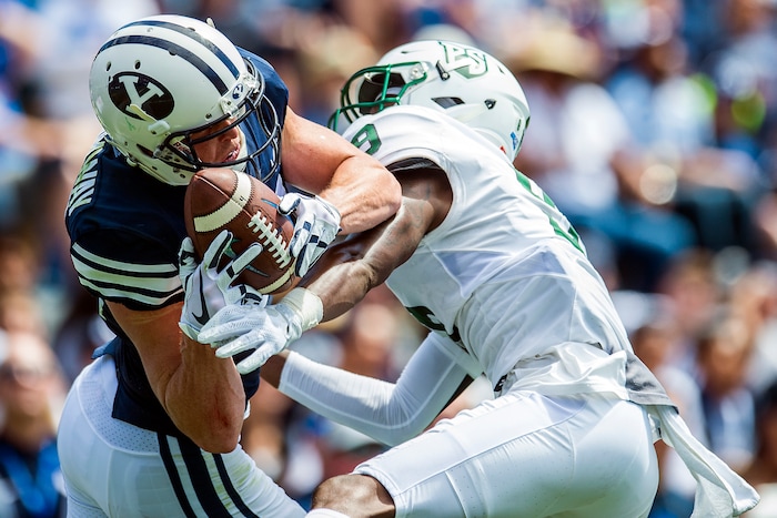 (Chris Detrick  |  The Salt Lake Tribune)  Brigham Young Cougars wide receiver Talon Shumway (21) makes a catch over Portland State Vikings cornerback Chris Seisay (9) during the game at LaVell Edwards Stadium Saturday, August 26, 2017.