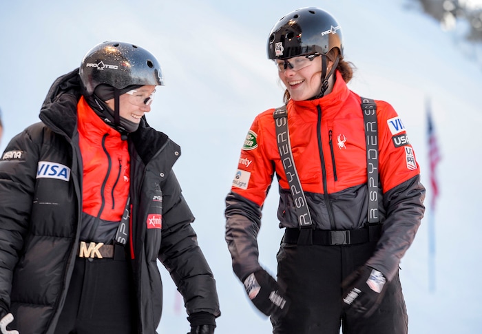 (Leah Hogsten  |  The Salt Lake Tribune) l-r Madison Varmette and Kaila Kuhn, both U.S. Freestyle Ski Team members, share a laugh prior to practice Jan. 7, 2020 at the Utah Olympic Park.