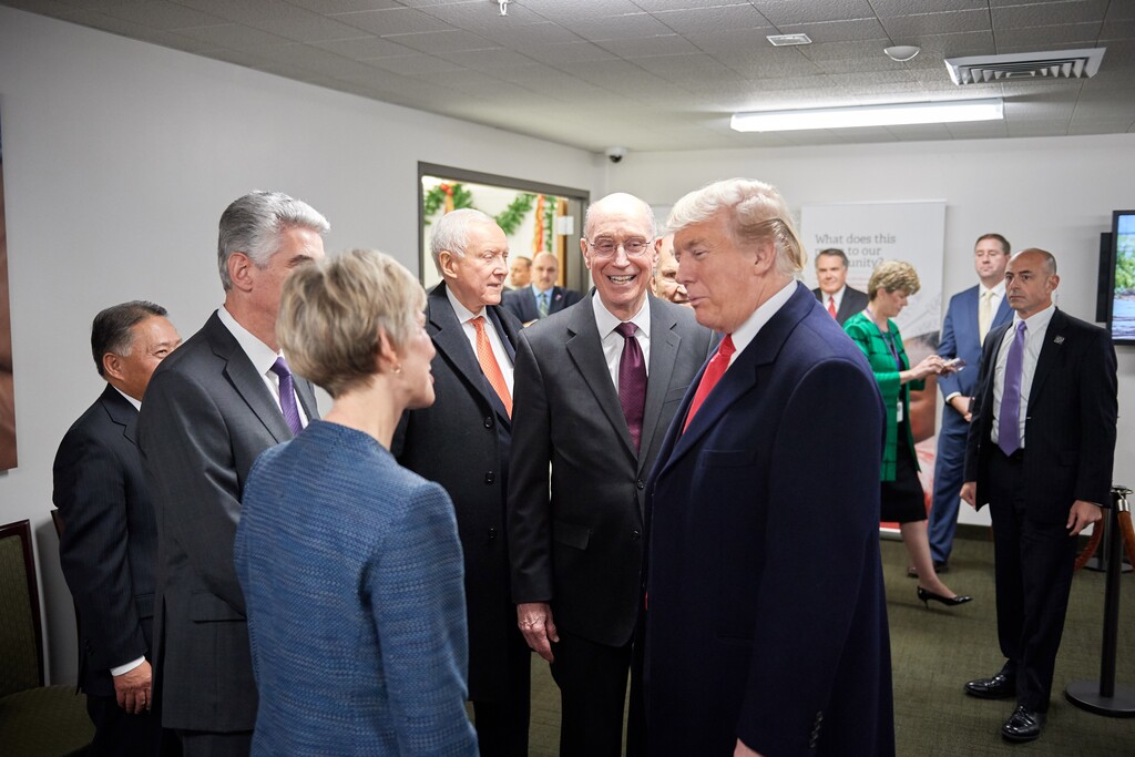 (Courtesy of The Church of Jesus Christ of Latter-day Saints) President Donald J. Trump visits with President Jean B. Bingham, head of the Relief Society, at Welfare Square in 2017. He was also greeted by President Henry B. Eyring of the First Presidency and Presiding Bishop Gérald Caussé.