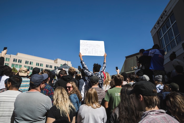 (Clark Clifford  |  Special to The Salt Lake Tribune) A fan holds their handmade sign towards the performers that reads "Jesus Walks" at Kanye West's Sunday Service at The Gateway in Salt Lake City on Saturday, Oct. 5, 2019.