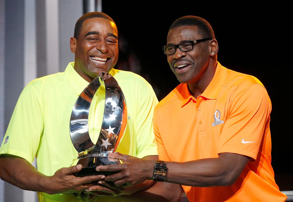 Cris Carter, left, is preparing to start a morning show on Fox Sports 1 next month. (AP Photo/Ross D. Franklin)