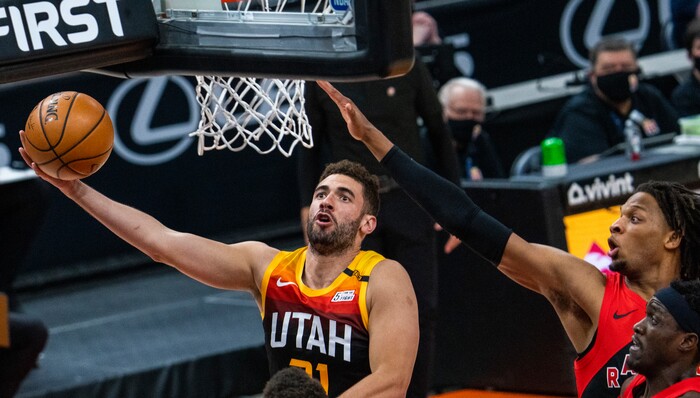 (Rick Egan | The Salt Lake Tribune) Utah forward Georges Niang (31) scores for the Jazz, as Toronto Raptors forward Freddie Gillespie (55) defends, in NBA action between the Utah Jazz and the Toronto Raptors at Vivint Arena, on Saturday, May 1, 2021.