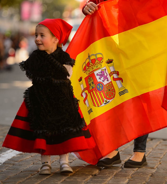 (Trent Nelson | The Salt Lake Tribune)
Olaia Slonaker Trillo and the Spanish flag in the third annual Hispanic Heritage Parade and Street Festival in Salt Lake City, Saturday Sept. 22, 2018.