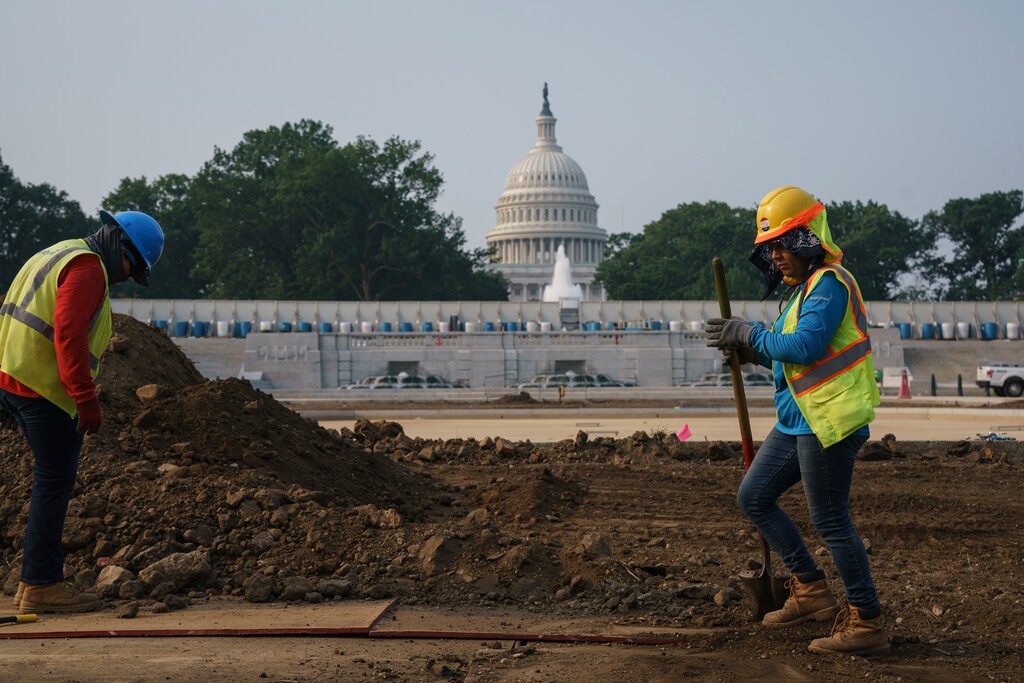 (J. Scott Applewhite | The Associated Press) In this July 21, 2021, photo workers repair a park near the Capitol in Washington. President Joe Biden has made passing the bipartisan plan a top priority, the first of his two-part $4 trillion proposal to rebuild, but a Senate test vote failed this week after Republicans said they needed more time to finish the package and review the details.