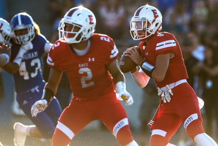 (Chris Detrick  |  The Salt Lake Tribune)  East's Ben Ford (8) looks to pass the ball during the game at Bingham High School Friday, August 25, 2017. Bingham is winning the game 24-17 at halftime. 