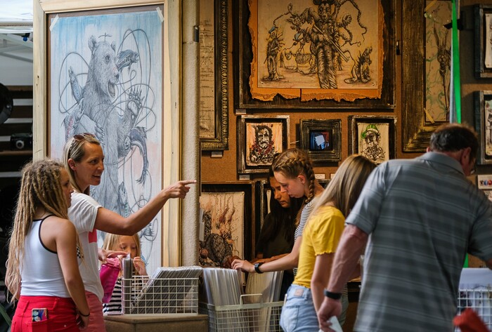 (Francisco Kjolseth  |  The Salt Lake Tribune)  The unique ballpoint pen works of artist Tai Taeoalii draws a crowd during the annual 2019 Utah Arts Festival as it kicks off at Library Square and Washington Square in downtown Salt Lake City, Thursday, June 20, 2019, with visual and performance art of all varieties and food for all ages from June 20-23.