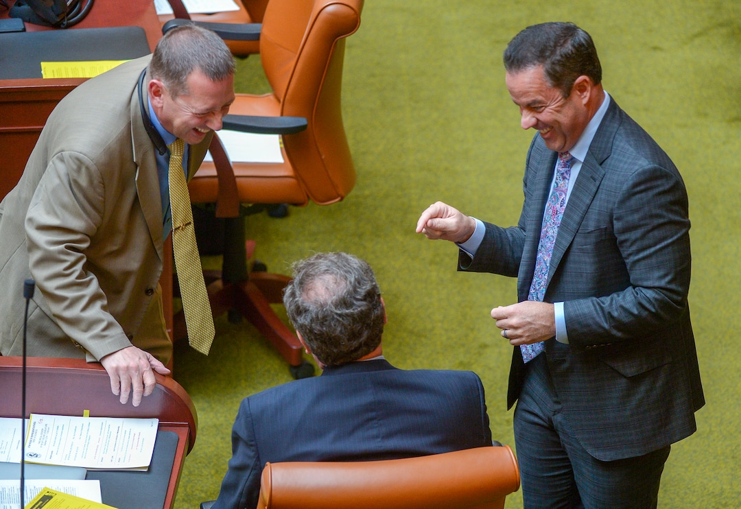 (Leah Hogsten  |  The Salt Lake Tribune)  L-r  Rep. Paul Ray, R-Clearfield and Rep. Brad Wilson, R-Kaysville share a laugh with Rep. Brian King, D-Salt Lake City, center, prior to the special session. Utah legislators voted to change the Utah Medical Cannabis Act, the bill that officials, Prop 2 opponents and medical marijuana advocates crafted and pitched as a compromise, Monday, Dec. 2, 2018 during a special session. Lawmakers voted for an overwritten version of the ballot initiative.