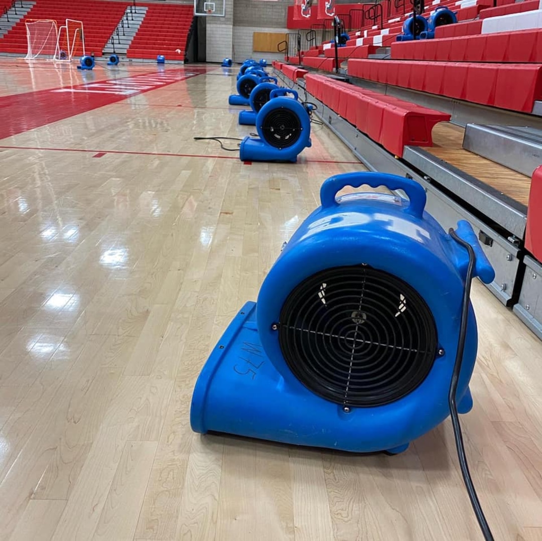 (Salt Lake City School District) The rainstorm that pounded Salt Lake City on Sunday, Aug. 2, 2021, flooded the basketball court at East High.