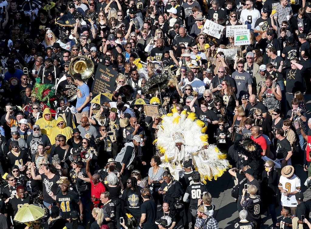(Michael DeMocker/The Times-Picayune via AP) Who Dats fill North Peters Street during the Blackout and Gold Second Line parade in New Orleans to protest the no call that likely cost the Saints a spot in today's Super Bowl on Sunday, Feb. 3, 2019.