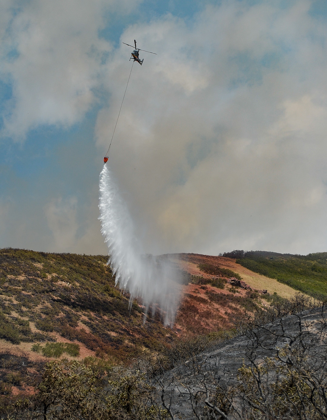 (Francisco Kjolseth  |  The Salt Lake Tribune)  Fire crews battle a fire in Bountiful that destroyed three homes and damaged five more that began early Friday morning, Aug. 30, 2019. On Sept. 2, officials said the fire was 100% contained.