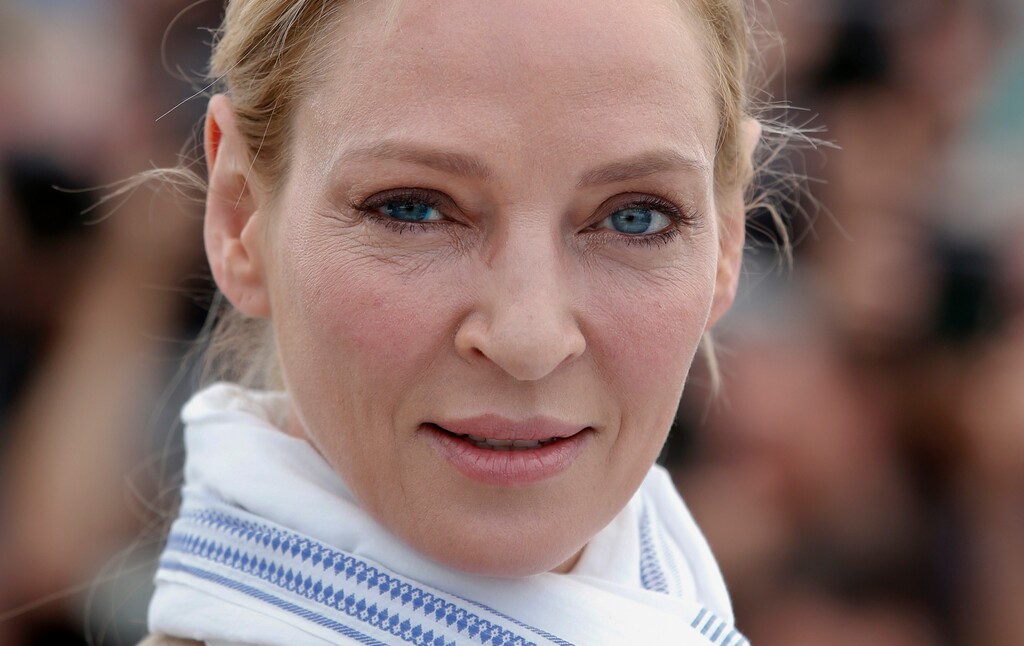 In this May 18, 2017 file photo, actress Uma Thurman poses for photographers during the photo call for the Un Certain Regard jury at the 70th international film festival, Cannes, southern France.  Thurman has accused embattled Hollywood producer Harvey Weinstein of forcing himself upon her sexually and director Quentin Tarantino of making her perform a dangerous car stunt that injured her. Thurman is quoted in The New York Times on Saturday, Feb. 3, 2018,  as saying Weinstein attacked her in London. She says he pushed her down and tried to shove himself on her and expose himself.  (AP Photo/Alastair Grant)