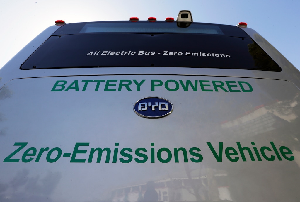 FILE - In this May 1, 2013, file photo, an All Electric Bus, a Zero-Emissions Vehicle, produced by China's BYD Co., is parked at the announcement of the opening of an electric bus manufacturing plant in Lancaster, Calif. The California Air Resources Board voted Friday, Dec. 14, 2018, to require that all new buses be carbon-free by 2029. Environmental advocates project that the last dirty buses will phase out by 2040. (AP Photo/Reed Saxon, File)