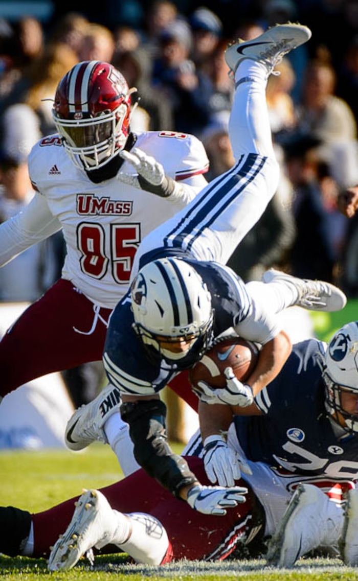 (Trent Nelson | The Salt Lake Tribune)  Brigham Young Cougars running back KJ Hall (24) dives for yardage as BYU hosts the University of Massachusetts, NCAA football in Provo, Saturday November 18, 2017.