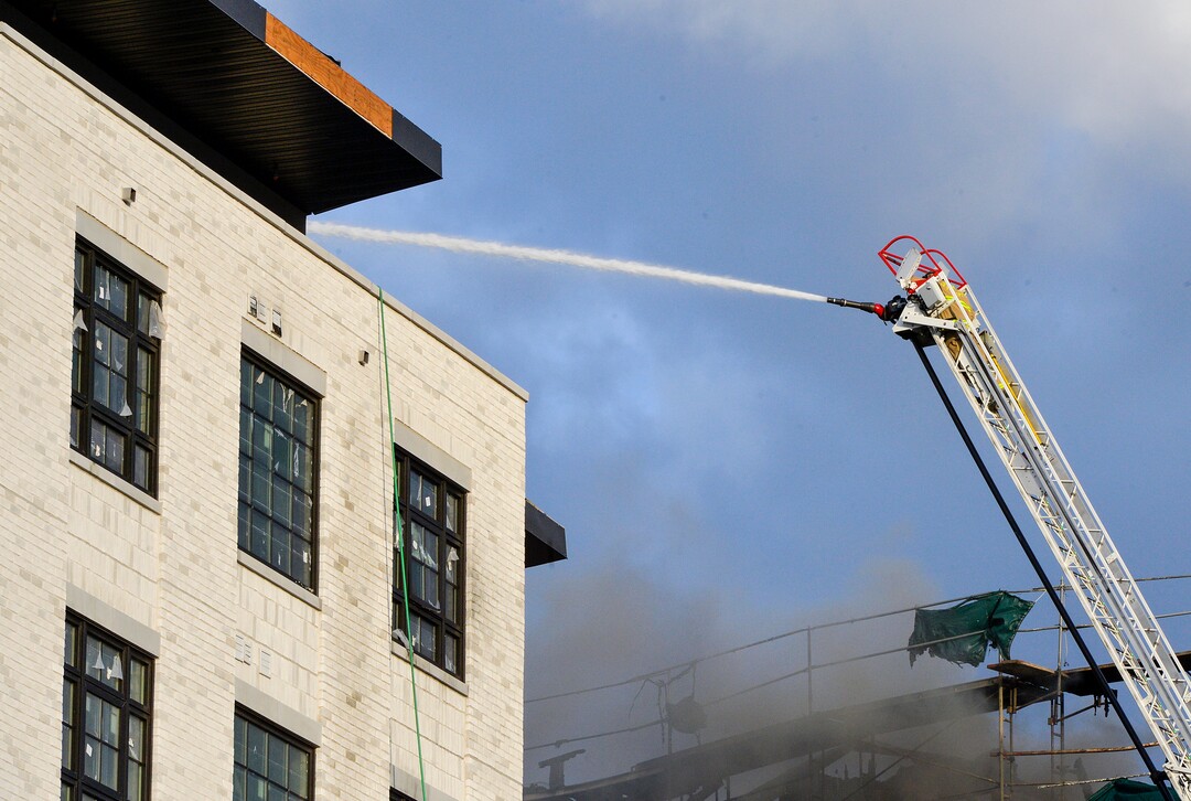 (Chris Samuels | The Salt Lake Tribune) Emergency crews continue to respond to a four-alarm fire in a new construction of apartment residences in Sugar House, Wednesday, Oct. 26, 2022.