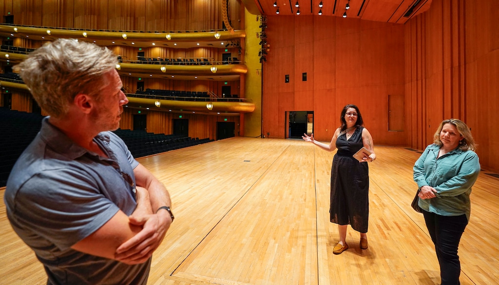 (Chris Samuels | The Salt Lake Tribune) From left, Utah Symphony violinists David Porter and Karen Wyatt, and principal bassoonist Lori Wike give a tour of Abravanel Hall in Salt Lake City, Monday, Aug. 19, 2024.