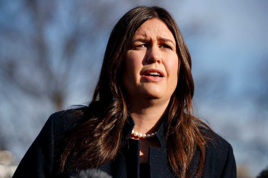 White House press secretary Sarah Huckabee Sanders talks with reporters outside the White House, Friday, Jan. 25, 2019, in Washington. (AP Photo/ Evan Vucci)