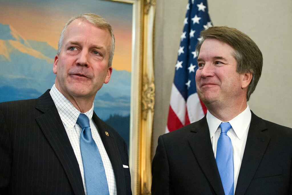 Supreme Court nominee Brett Kavanaugh, right, stands with Sen. Dan Sullivan, R-Alaska, before the start of their meeting, Thursday, July 12, 2018, on Capitol Hill in Washington. (AP Photo/Cliff Owen)