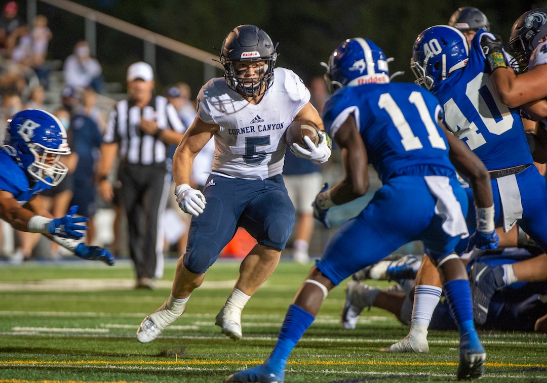 (Rick Egan  |  The Salt Lake Tribune)     Hayden Easterly runs the ball for Corner Canyon, in prep action between the Bingham Miners and the Corner Canyon Chargers, at Bingham High onFriday, Aug. 28, 2020.