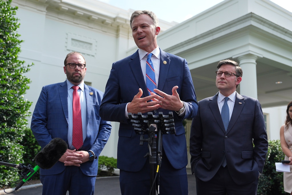 (Evan Vucci | AP) Rep. Blake Moore, R-Utah, speaks with members of the media as Rep. Jason Smith, R-Mo., left, and House Speaker Mike Johnson, R-La., listen outside the West Wing after an "Invest in America" roundtable with business leaders at the White House, Monday, June 9, 2025, in Washington.