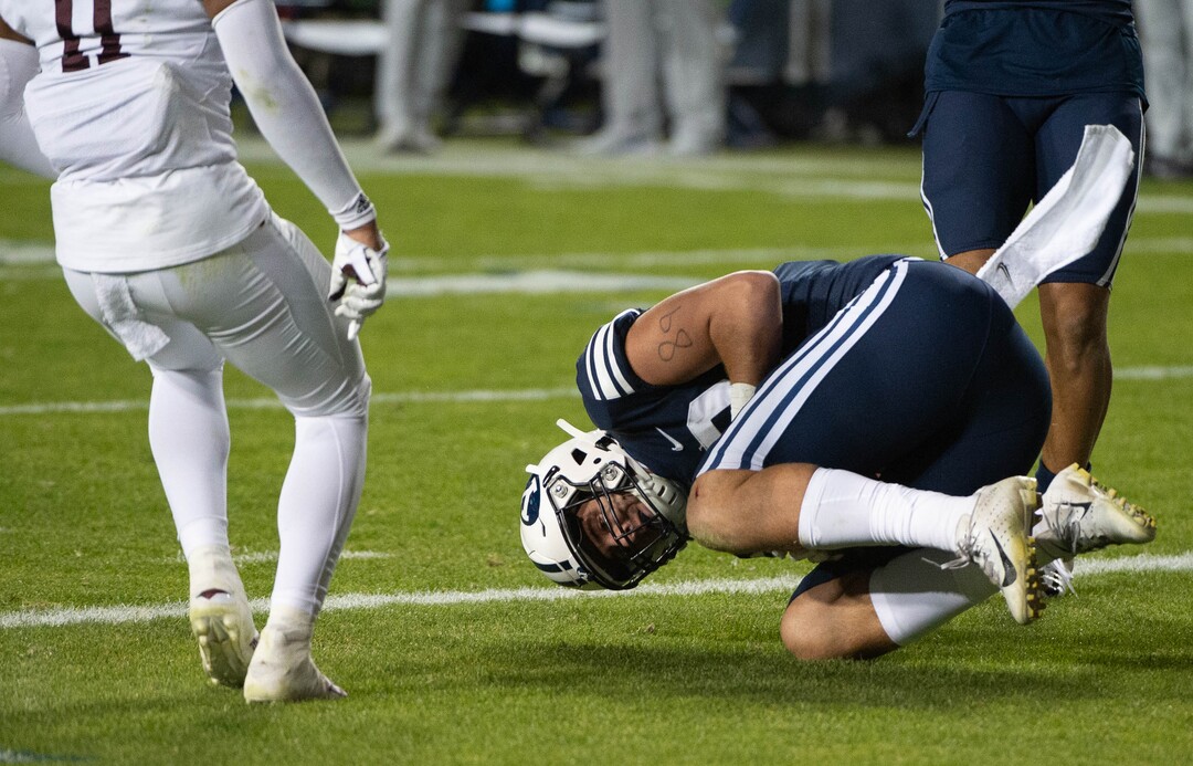(Francisco Kjolseth  |  The Salt Lake Tribune) Brigham Young Cougars tight end Matt Bushman (89) rolls in for a touchdown as BYU takes on Texas State during an NCAA college football game at LavVell Edwards Stadium, Saturday, oct. 24, 2020, in Provo, Utah.