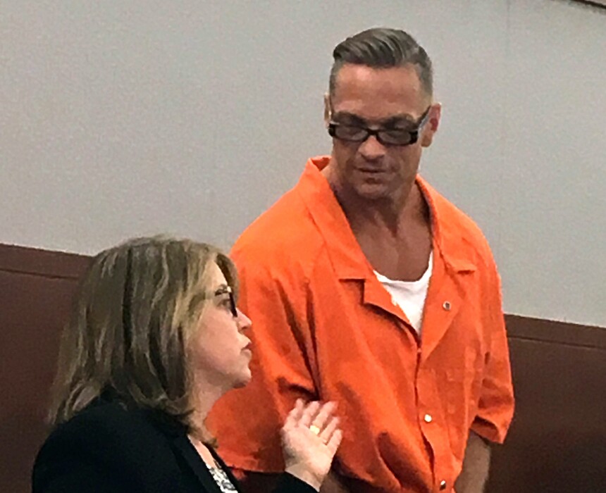 FILE - In this Aug. 17, 2017, file photo, Nevada death row inmate Scott Raymond Dozier, right, confers with Lori Teicher, a federal public defender involved in his case, during an appearance in Clark County District Court in Las Vegas. Authorities say the 48-year-old Nevada death-row inmate who wanted for two years to die, but whose execution was postponed twice, was found dead in his cell on Saturday, Jan. 5, 2019, from an apparent hanging. (AP Photo/Ken Ritter, File)