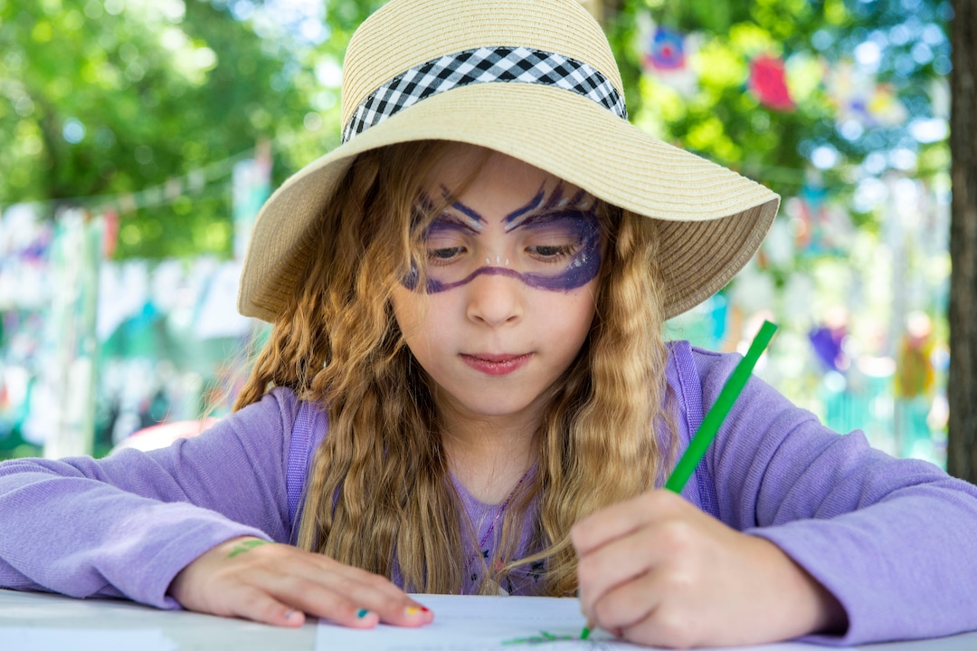(Rick Egan  |  The Salt Lake Tribune)   Jane Jane Virost, from Kaysville, works a a butterfly drawing in the Art Yard, at the Utah Arts Festival, Saturday, June 22, 2019.