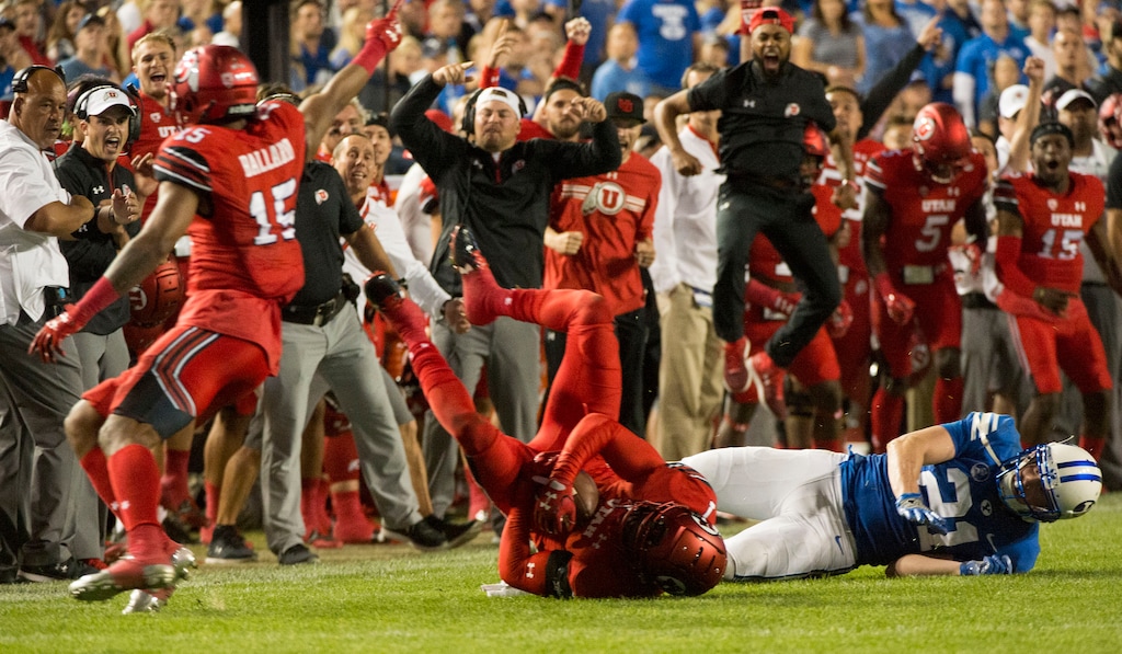 (Rick Egan  |  The Salt Lake Tribune)  The Utah bench celebrates as Ute  defensive back Jaylon Johnson (7) intercepts a pass intended for Brigham Young Cougars wide receiver Talon Shumway (21), in football action BYU vs Utah, at Lavell Edwards Stadium in Provo, Saturday, September 9, 2017.