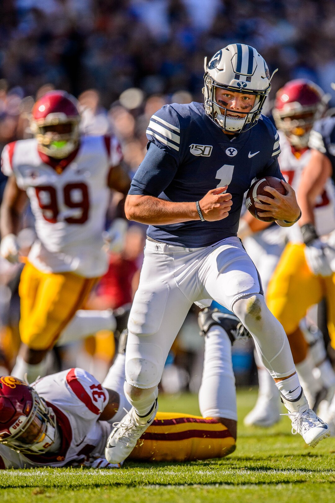 (Trent Nelson  |  The Salt Lake Tribune)  Brigham Young Cougars quarterback Zach Wilson (1) runs for a late touchdown as BYU hosts USC, NCAA football in Provo on Saturday Sept. 14, 2019.