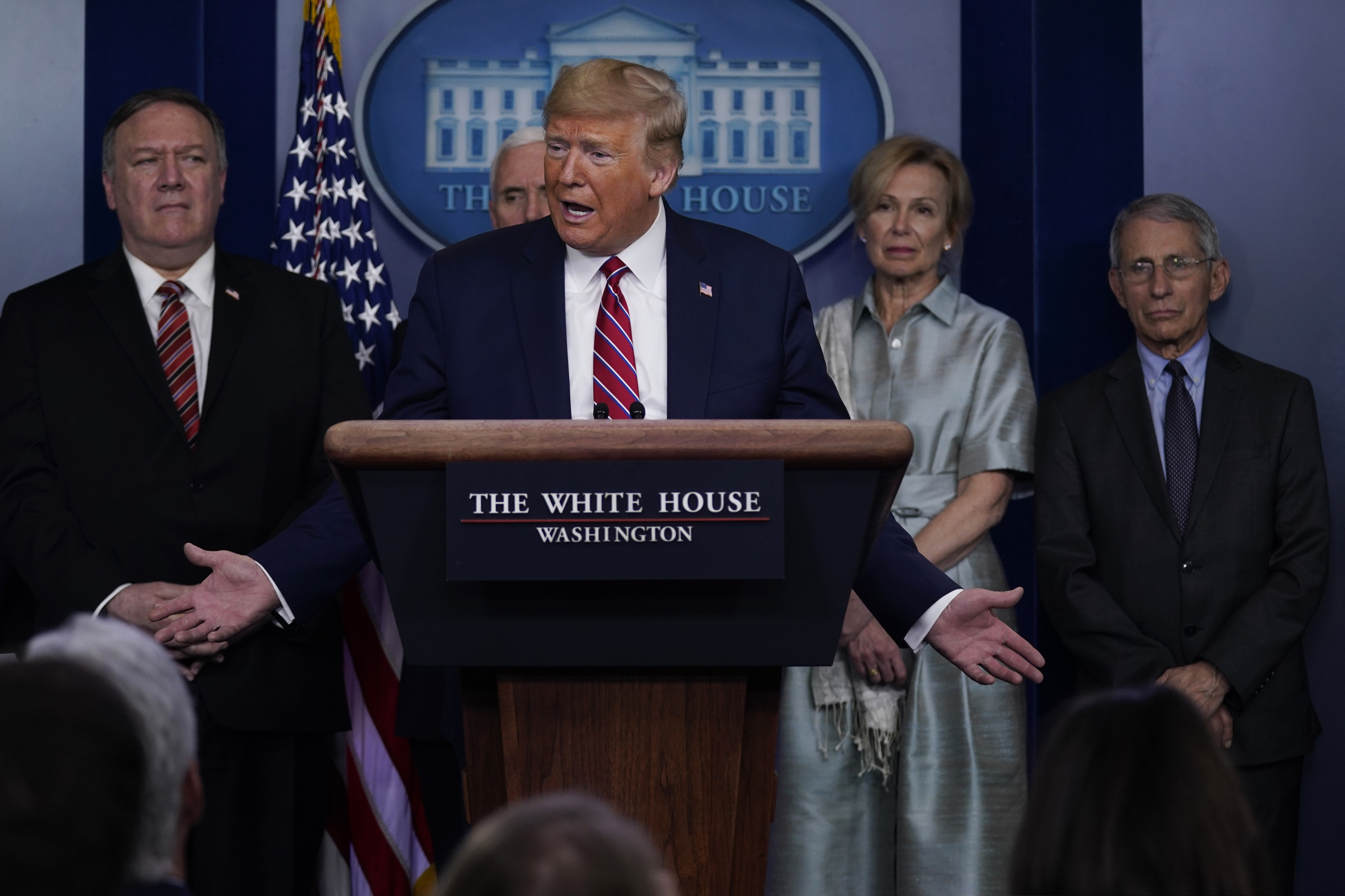 President Donald Trump speaks during a coronavirus task force briefing at the White House, Friday, March 20, 2020, in Washington. From left, Secretary of State Mike Pompeo Vice President Mike Pence, Trump, White House coronavirus response coordinator Dr. Deborah Birx and Director of the National Institute of Allergy and Infectious Diseases Dr. Anthony Fauci. (AP Photo/Evan Vucci)