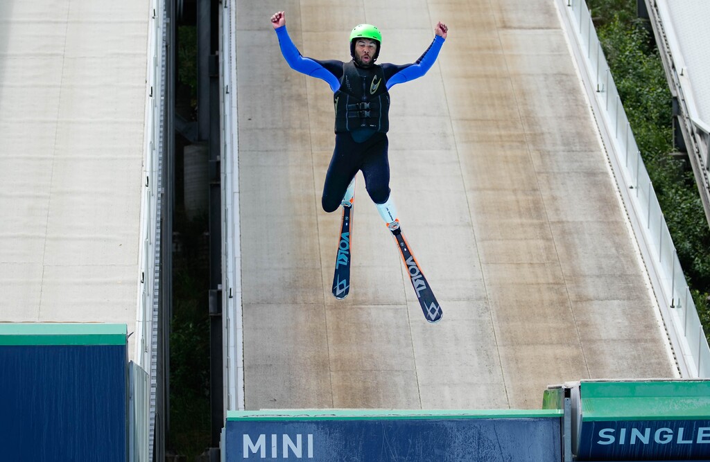 (Francisco Kjolseth | The Salt Lake Tribune) NASCAR driver Bubba Wallace tries ski jumping for the first time at the Utah Olympic Park on Wednesday, July 13, 2022. The US Ski & Snowboard team hosted several professional drivers for a bobsled run, an aerials demonstration and a workout at the training center.