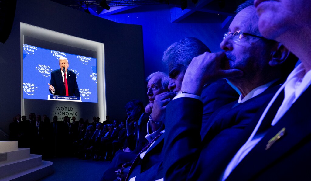 (Doug Mills | The New York Times) President Donald Trump is visible on a video monitor as he addresses the World Economic Forum in Davos, Switzerland, on Wednesday, Jan. 21, 2026. Trump told European leaders here that he would not send troops to seize Greenland from Denmark, while still demanding ownership of the island.
