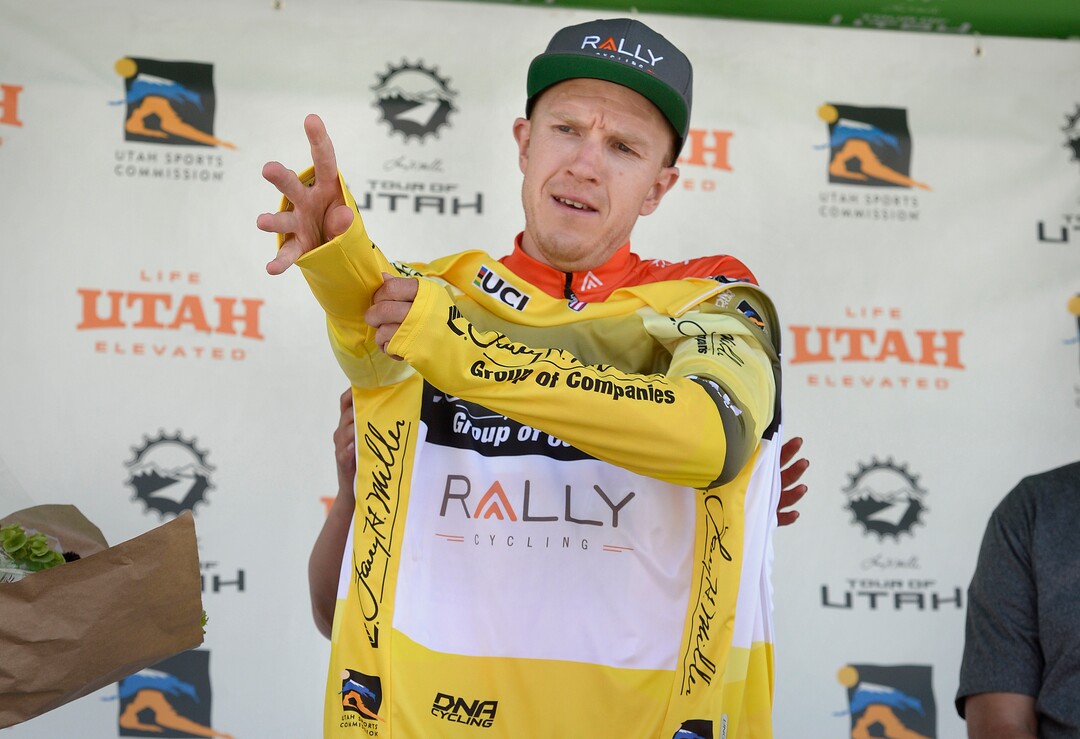 (Scott Sommerdorf   |  The Salt Lake Tribune)   Stage 3 winner Robert Britton slips on the yellow leader's jersey after his Stage 3 time trial win in Big Cottonwood Canyon, Wednesday, August 2, 2017.