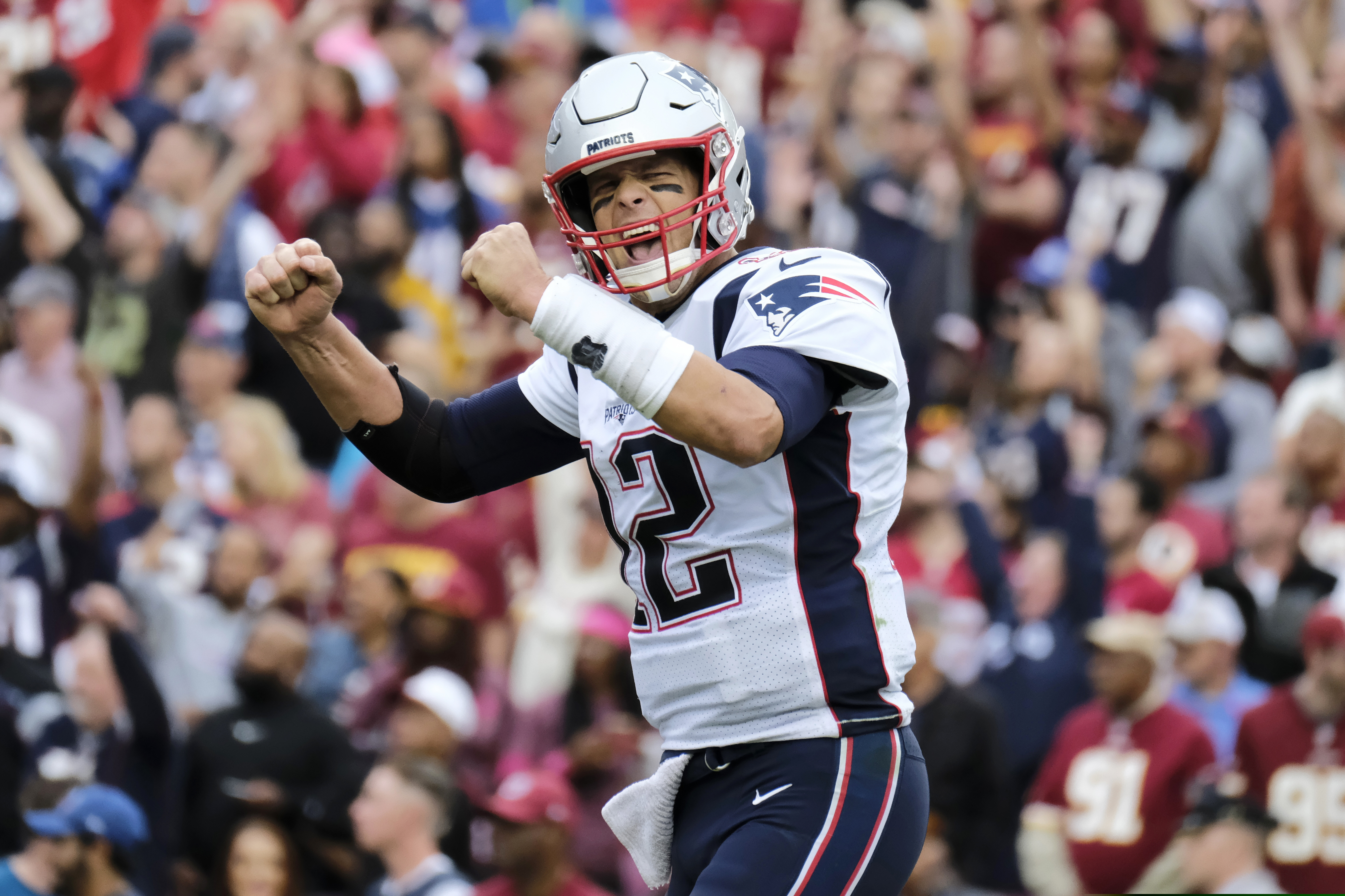 FILE - In this Oct. 6, 2019, file photo, New England Patriots quarterback Tom Brady (12) reacts to a touchdown against Washington during the second half of an NFL football game in Washington. Brady, the centerpiece of the New England Patriots’ championship dynasty over the past two decades, appears poised to leave the only football home he has ever had. The 42-year-old six-time Super Bowl winner posted Tuesday, March 17, 2020, on social media “my football journey will take place elsewhere.” The comments were the first to indicate the most-decorated player in NFL history would leave New England. (AP Photo/Mark Tenally, File)