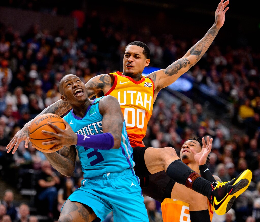 (Trent Nelson  |  The Salt Lake Tribune) Utah Jazz guard Jordan Clarkson (00) defending Charlotte Hornets guard Terry Rozier (3) as the Utah Jazz host the Charlotte Hornets, NBA basketball in Salt Lake City on Friday, Jan. 10, 2020.