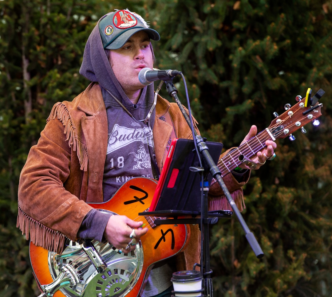 (Rick Egan  |  The Salt Lake Tribune)       Tom Bennett performs at the second annual Made in Utah Winter Fest at The Gateway.  The free festival includes local artists, musicians, artisans, breweries, distilleries, food trucks, and other local businesses, to help promote shopping locally for holidays. The Utah Winter Fest continues December 21 & 22. Sunday, Dec. 15, 2019.