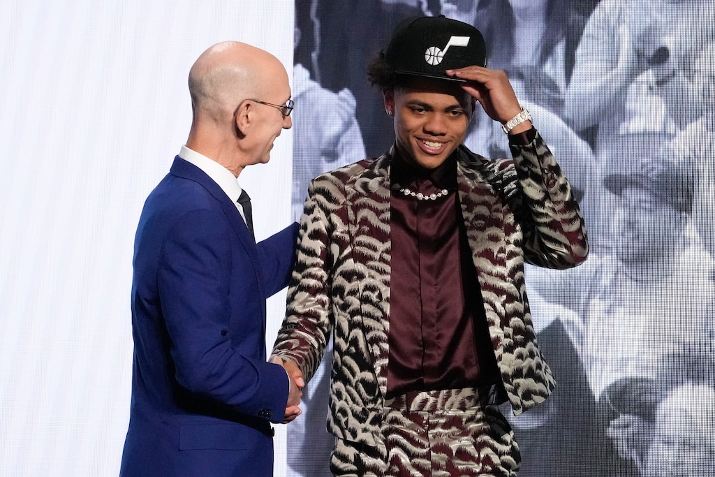Keyonte George is greeted by NBA Commissioner Adam Silver after being selected 16th overall by the Utah Jazz during the NBA basketball draft, Thursday, June 22, 2023, in New York. (AP Photo/John Minchillo)