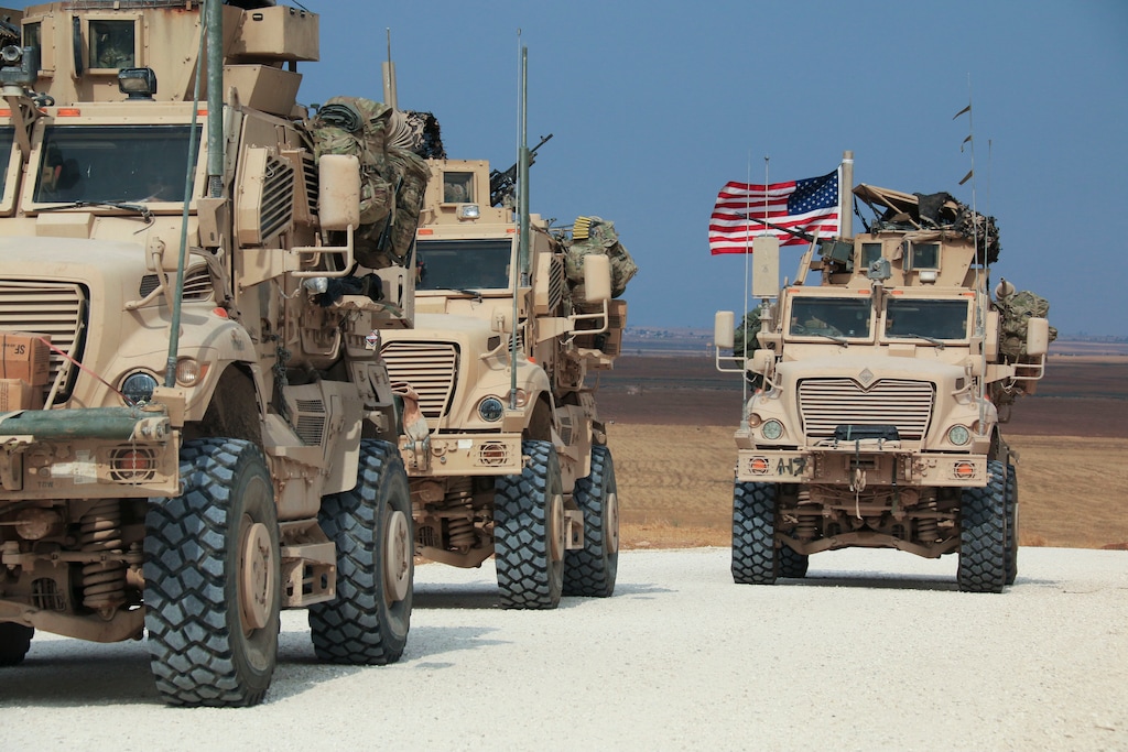 (Baderkhan Ahmad | AP) American military convoy stops near the town of Tel Tamr, north Syria, Sunday, Oct. 20, 2019. Kurdish-led fighters and Turkish-backed forces clashed sporadically Sunday in northeastern Syria amid efforts to work out a Kurdish evacuation from a besieged border town, the first pull-back under the terms of a U.S.-brokered cease-fire.