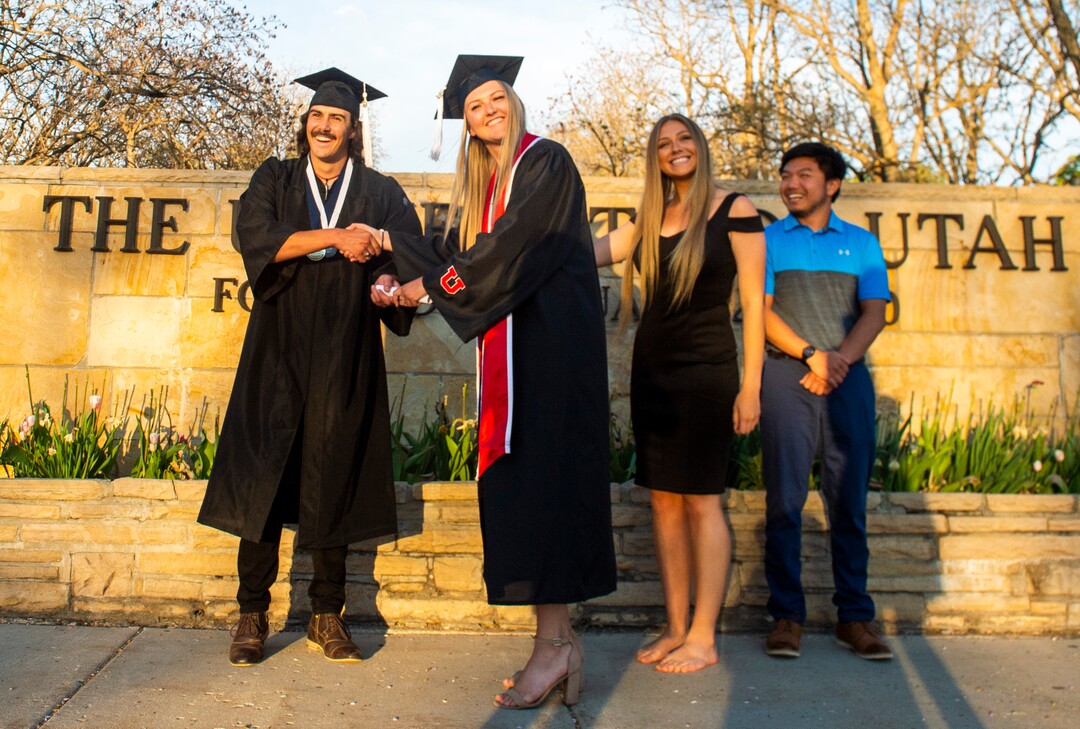 (Rick Egan  |  The Salt Lake Tribune)    Chafen Robbins presents a diploma to Emma McFee along with her friends  Hanna Bertelsen and Cameron Castua, in a mock graduation ceremony at Presidents Circle at the University of Utah, Thursday April 30, 2020