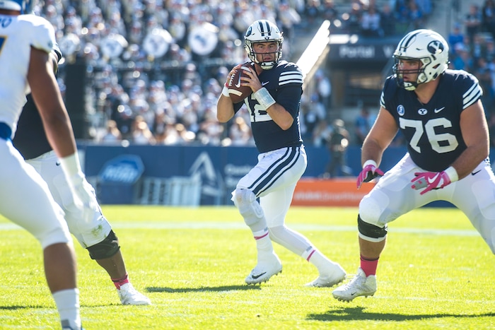 (Chris Detrick  |  The Salt Lake Tribune)  Brigham Young Cougars quarterback Tanner Mangum (12) looks to pass theball during the game at LaVell Edwards Stadium Saturday, October 28, 2017.  
