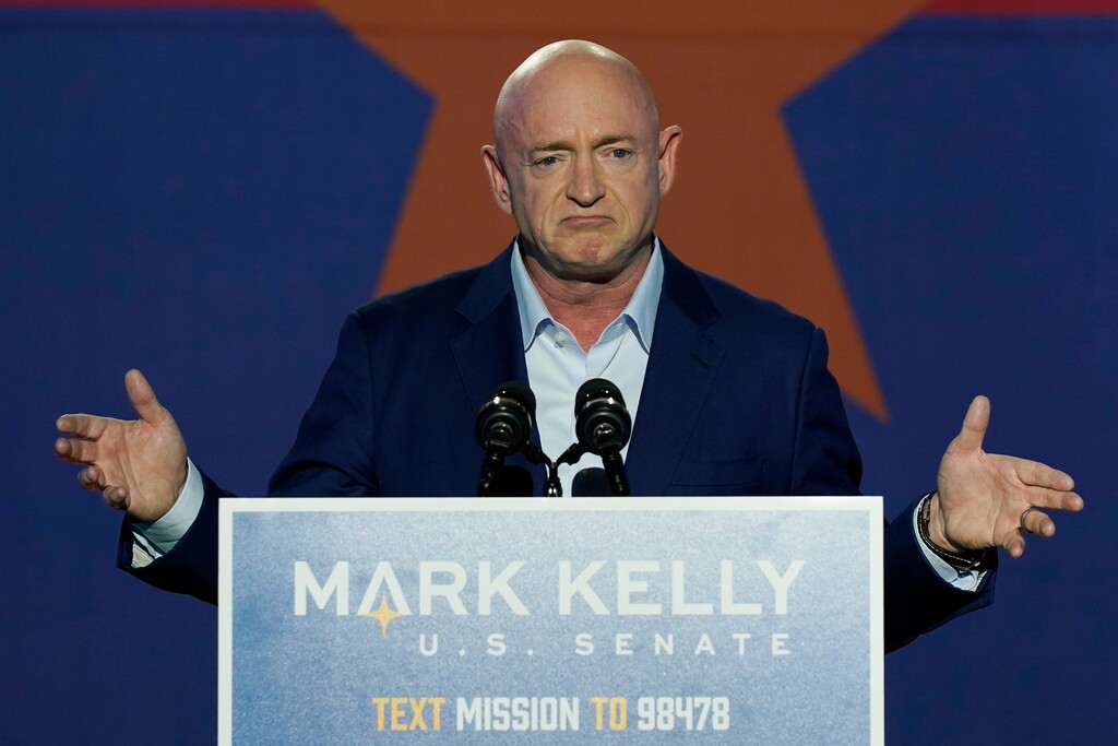 Mark Kelly, Arizona Democratic candidate for U.S. Senate, gestures as he speaks at an election night event Tuesday, Nov. 3, 2020 in Tucson, Ariz. (AP Photo/Ross D. Franklin)