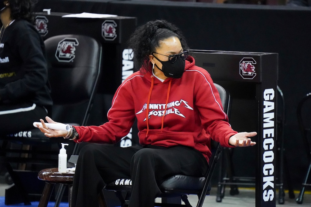 (AP Photo | Sean Rayford) South Carolina head coach Dawn Staley gestures from the bench on Sunday, Feb. 21, 2021, in Columbia, S.C. Staley decided to pull out of an upcoming women’s basketball series with Brigham Young University over concerns of racism; the school says it does not owe any fees for that cancellation.