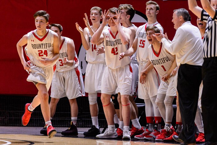 (Trent Nelson | The Salt Lake Tribune)  Skyline vs. Bountiful, 5A State high school basketball tournament at the Huntsman Center in Salt Lake City, Wednesday Feb. 28, 2018. Bountiful players celebrate a three-pointer by Bountiful's Camron Chism (24).