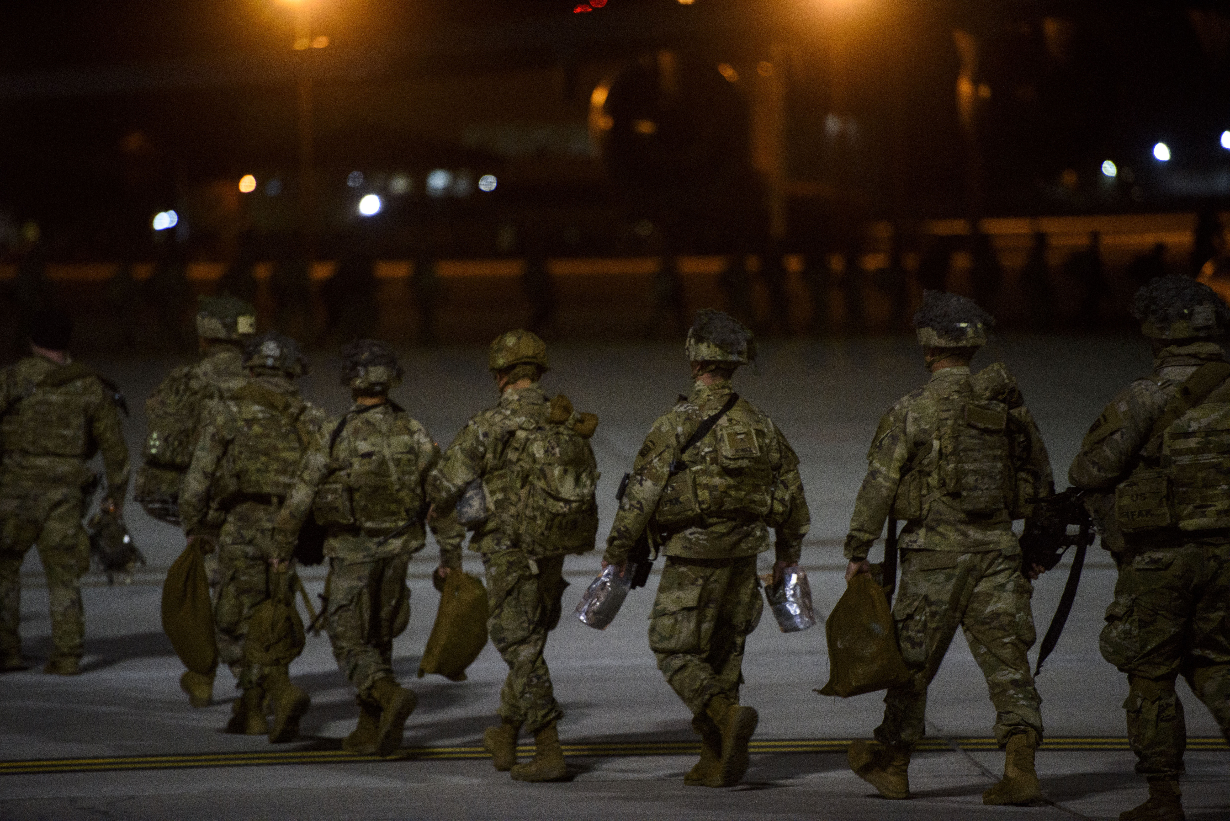 (Melissa Sue Gerrits | The Fayetteville Observer via AP) Soldiers board a C-17 aircraft Wednesday, Jan. 1, 2020 at Fort Bragg, N.C., to be deployed in Iraq.