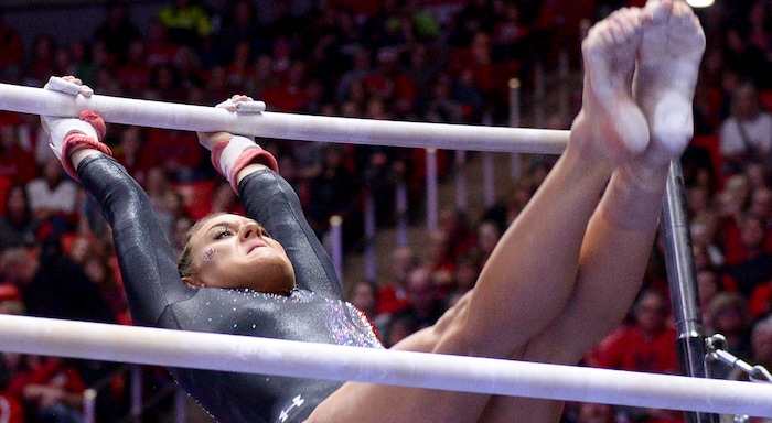 (Leah Hogsten  |  The Salt Lake Tribune) Tiffani Lewis on the uneven bars as the No. 4 Utah gymnasts host No. 20 Georgia in the final regular season meet at Jon M Huntsman Center in Salt Lake City Friday, March 16, 2018. 