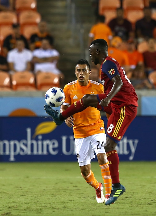 Real Salt Lake midfielder Stephen Sunday (8) gains possession of the ball during the first half of an MLS match against the Houston Dynamo, Saturday, Aug. 18, 2018, in Houston. (Godofredo A. Vasquez/Houston Chronicle via AP)
