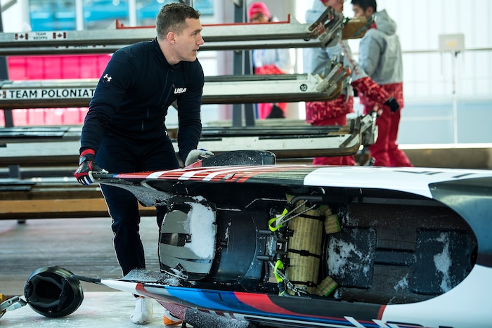 (Chris Detrick  |  The Salt Lake Tribune)  USA's Chris Fogt helps get the sled off of the track after the 4-man Official Training at Olympic Sliding Centre during the Pyeongchang 2018 Winter Olympics Wednesday, Feb. 21, 2018. 