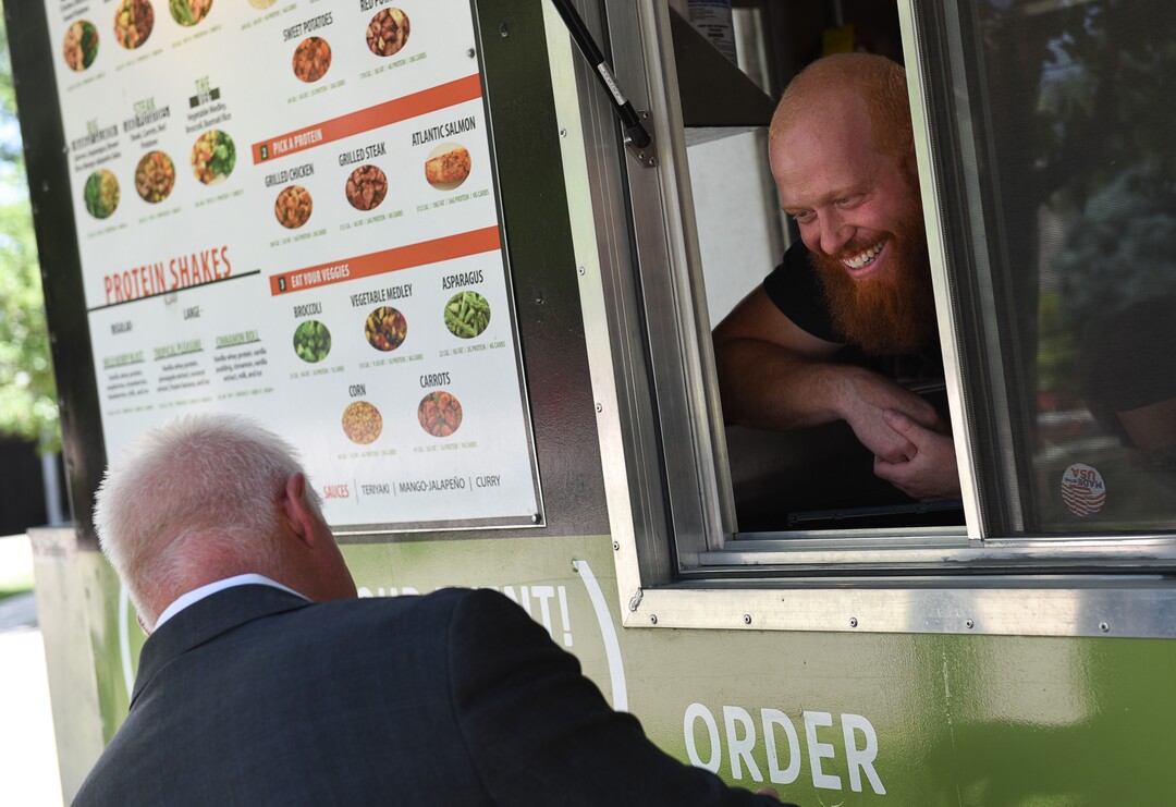 (Francisco Kjolseth  |  The Salt Lake Tribune)  Co-owner Jared Trust takes orders at the Clean Eats food truck that serves healthy meals with lean proteins and fresh vegetables.