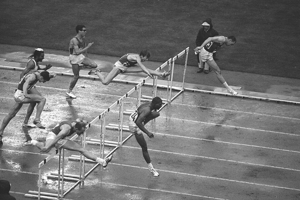 (AP Photo) Hayes Jones of Detroit, bottom right, and Blaine Lindgren of Salt Lake City, clear the last hurdle in the 110-meter hurdle final which Jones won at the Olympic games in Tokyo, Oct. 18, 1964. At bottom left is Russia's Anatoly Mikhailov who came in third. At top left is Mariel Duriez of France of who ran fifth, and going over a hurdle is Edy Ottoz of Italy, who came in fourth.