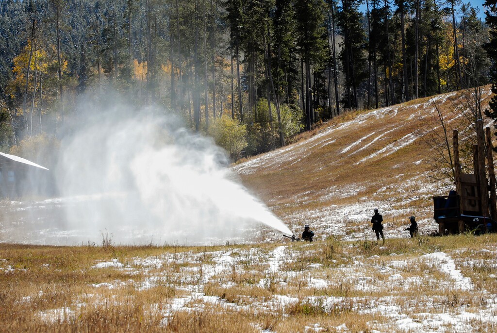 Beaver Creek snowmakers fire up the guns for training in Beaver Creek, Colo. in this Oct. 12, 2018, photo. Ski resorts have spent many decades amassing water rights and water storage and continuously upgrading snowmaking systems to make the state's vibrant, multibillion-dollar resort industry virtually immune to drought - so long as this winter, farmers and ranchers have repeatedly said over the summer, is wetter than last winter and those critical reservoirs are filled to brimming come spring. (Chris Dillmann/Vail Daily via AP, File)