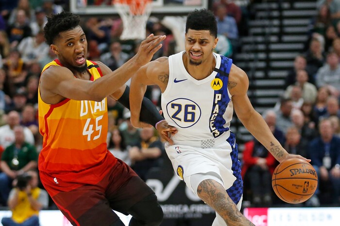 Utah Jazz guard Donovan Mitchell (45) guards Indiana Pacers guard Jeremy Lamb (26) in the first half during an NBA basketball game Monday, Jan. 20, 2020, in Salt Lake City. (AP Photo/Rick Bowmer)